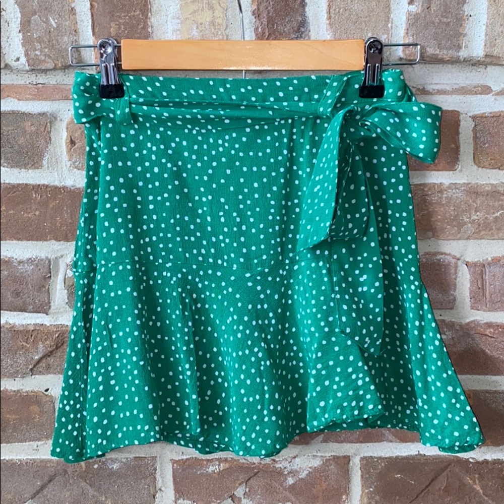 Green skirt with white polka dots
